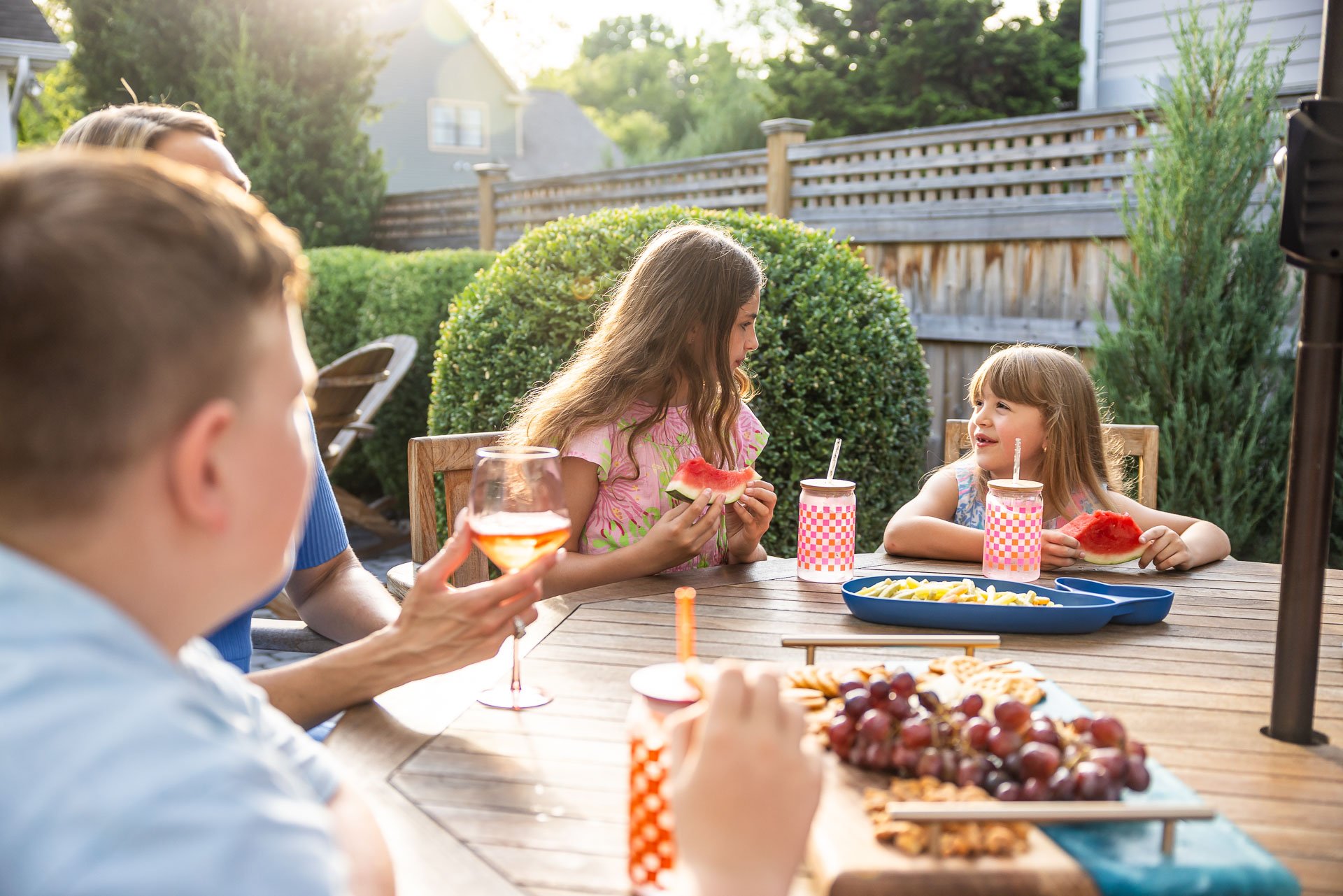 family enjoying dinner in their yard