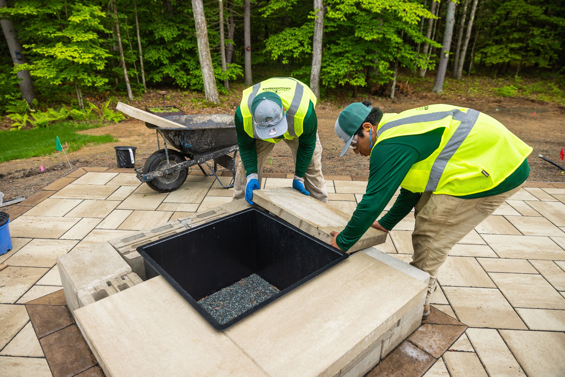 installing a wood fire pit container