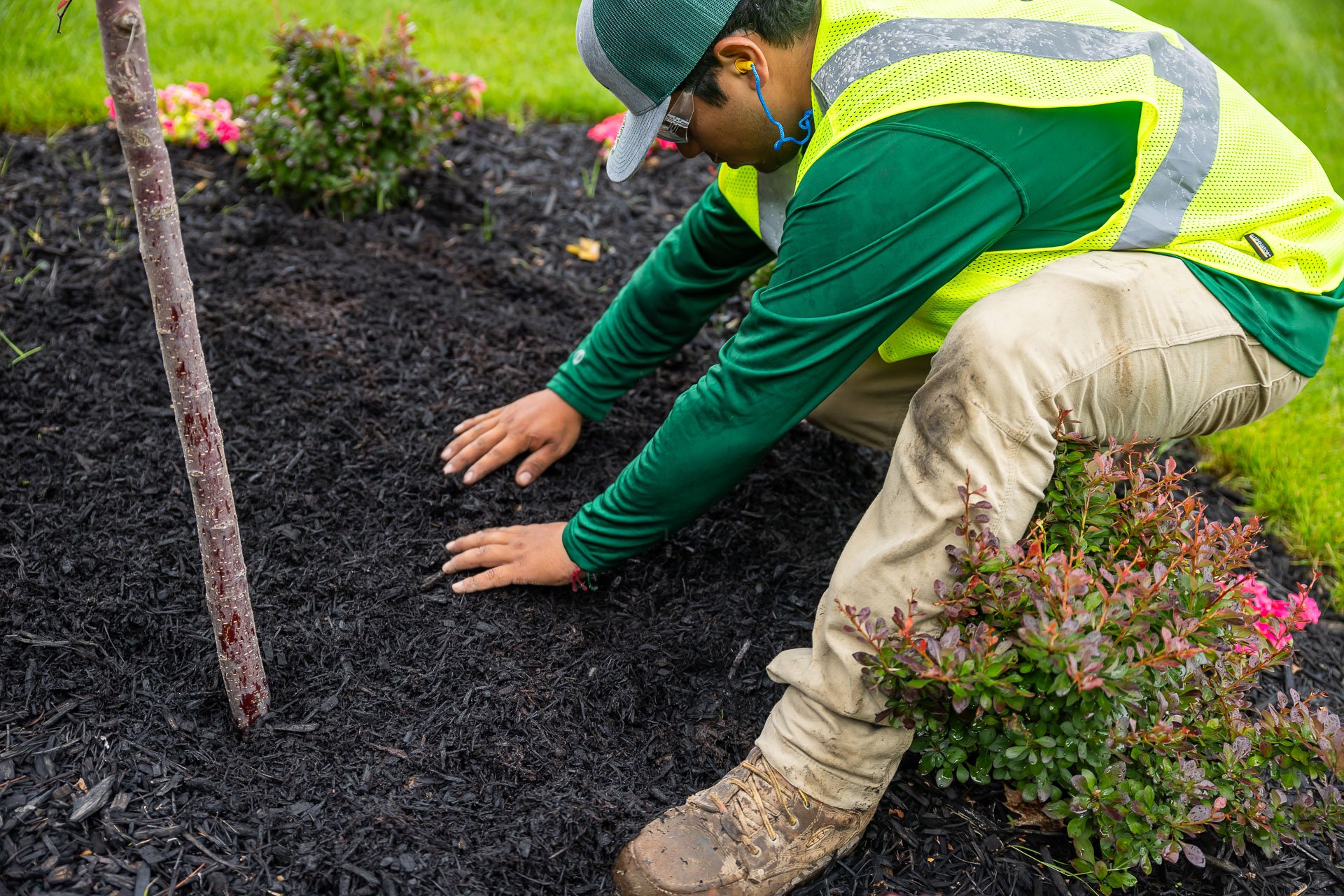 mulch being installed in a planting bed