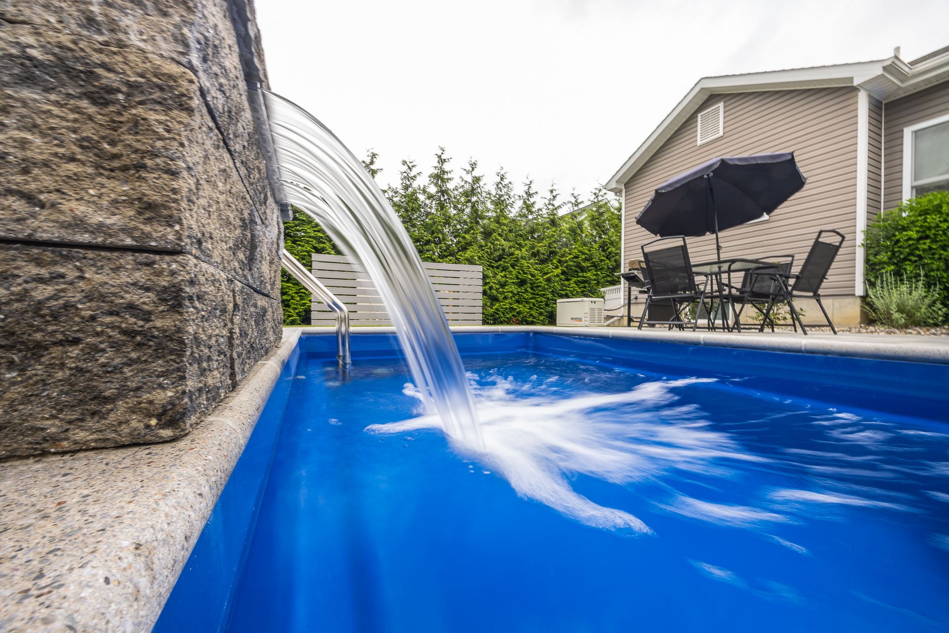 scupper pouring water into a pool