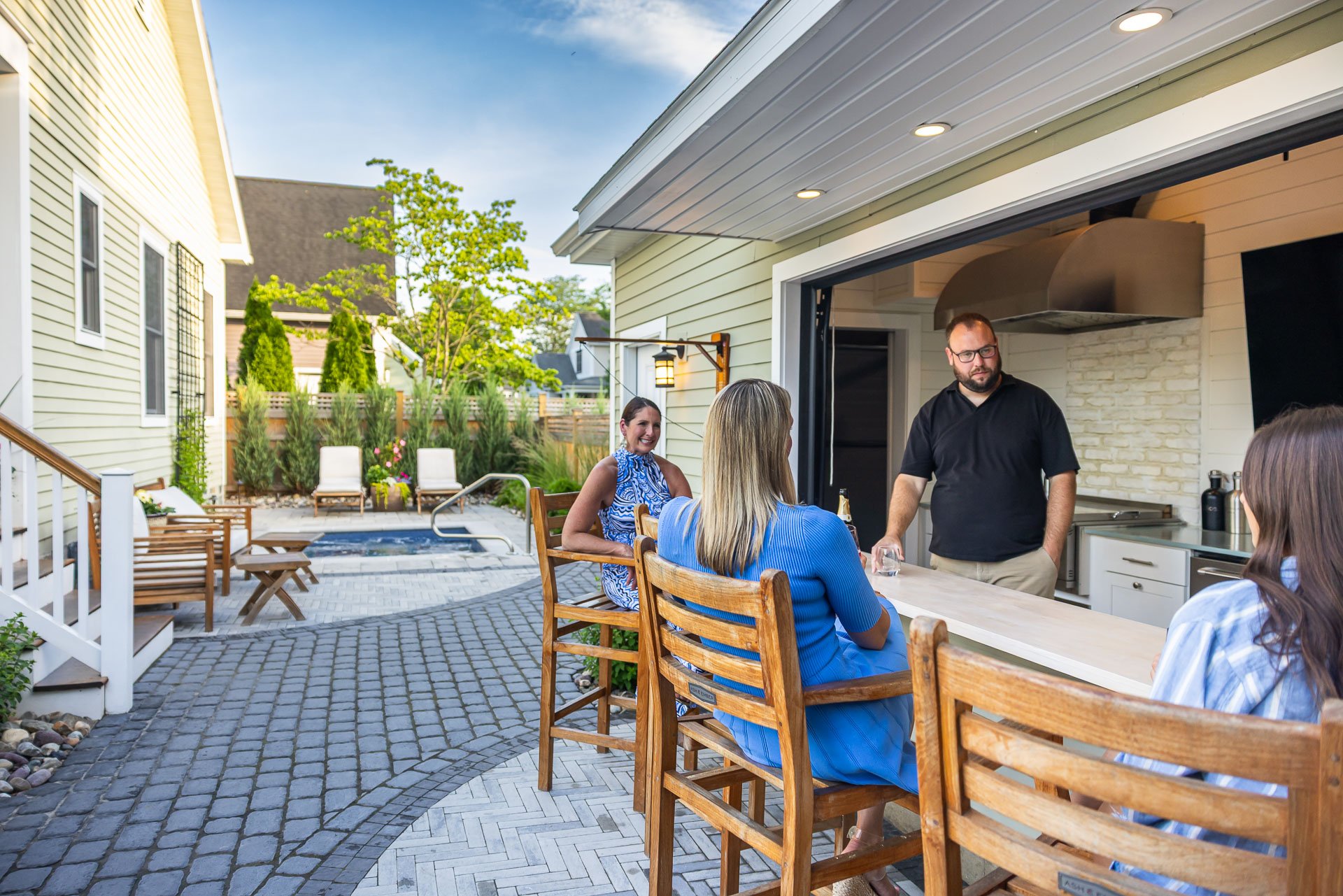 family sitting at their outdoor bar