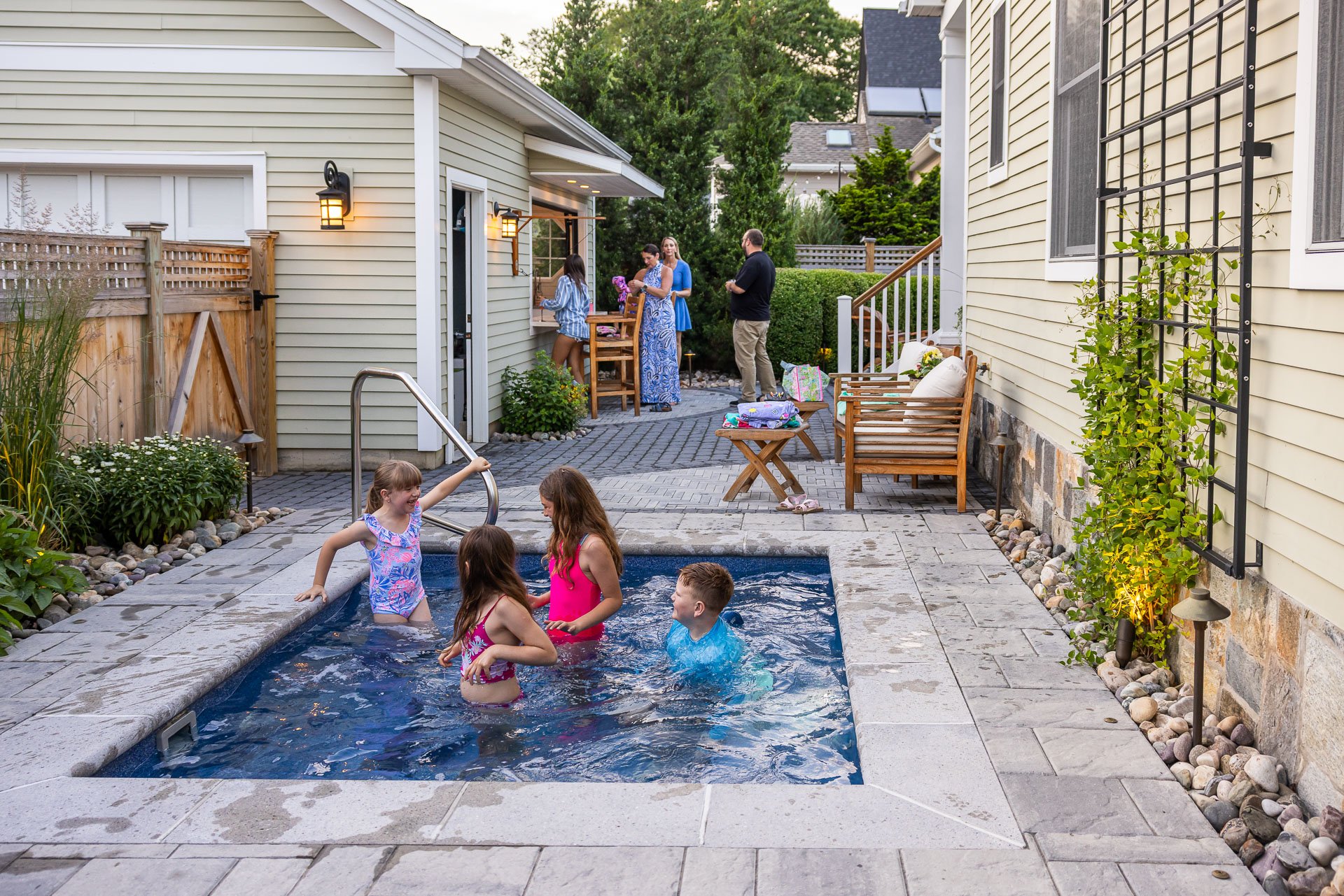 family enjoying their timely finished landscape project