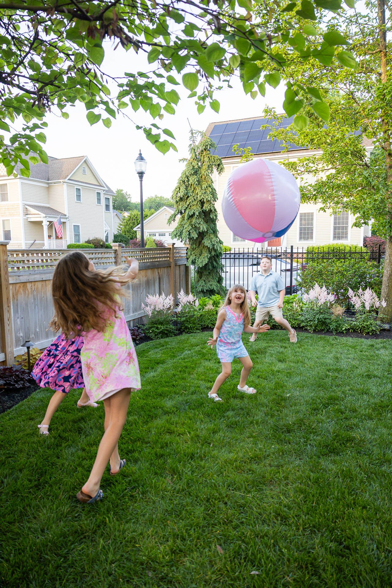 family playing in a saratoga springs backyard