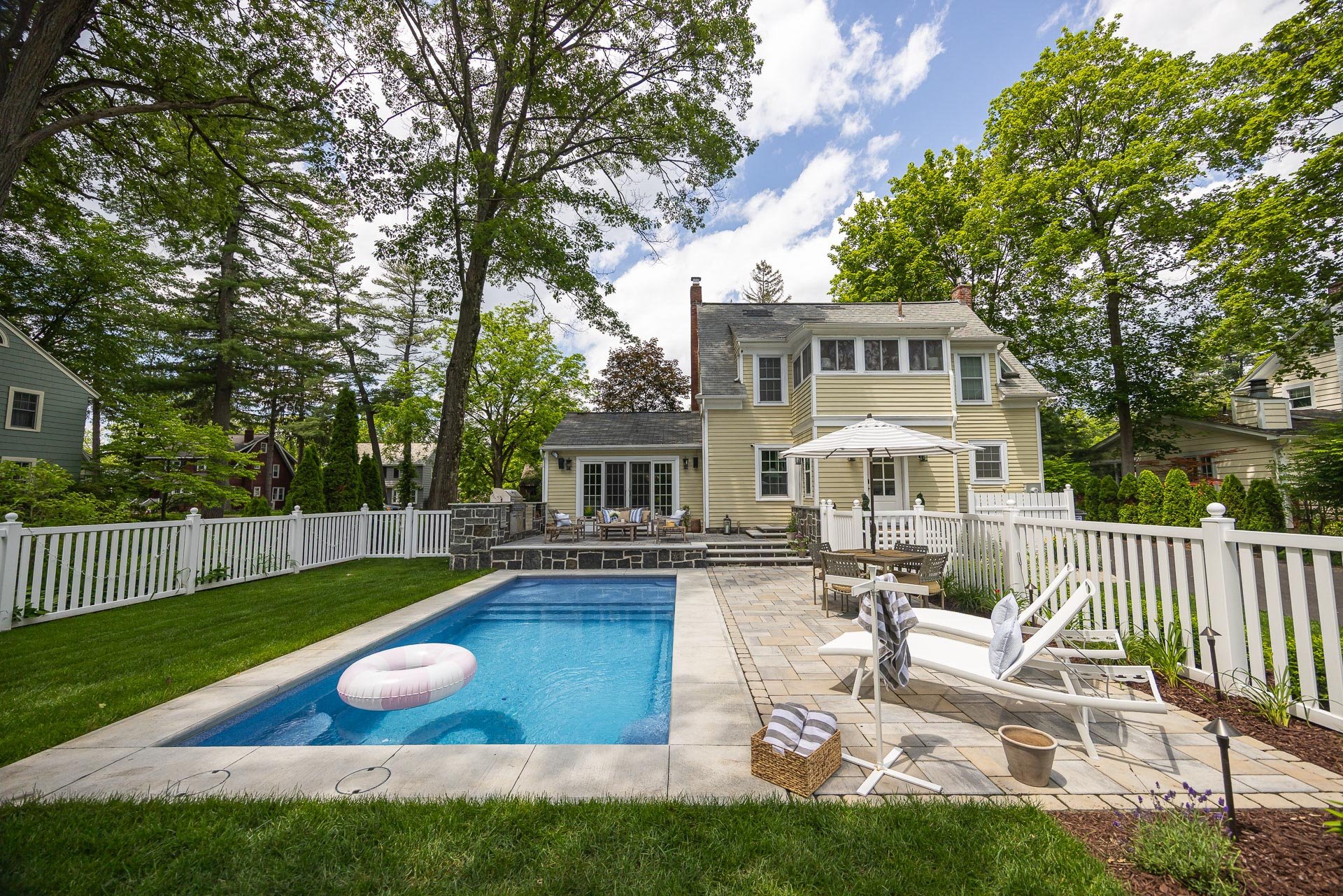 pool with patio spaces