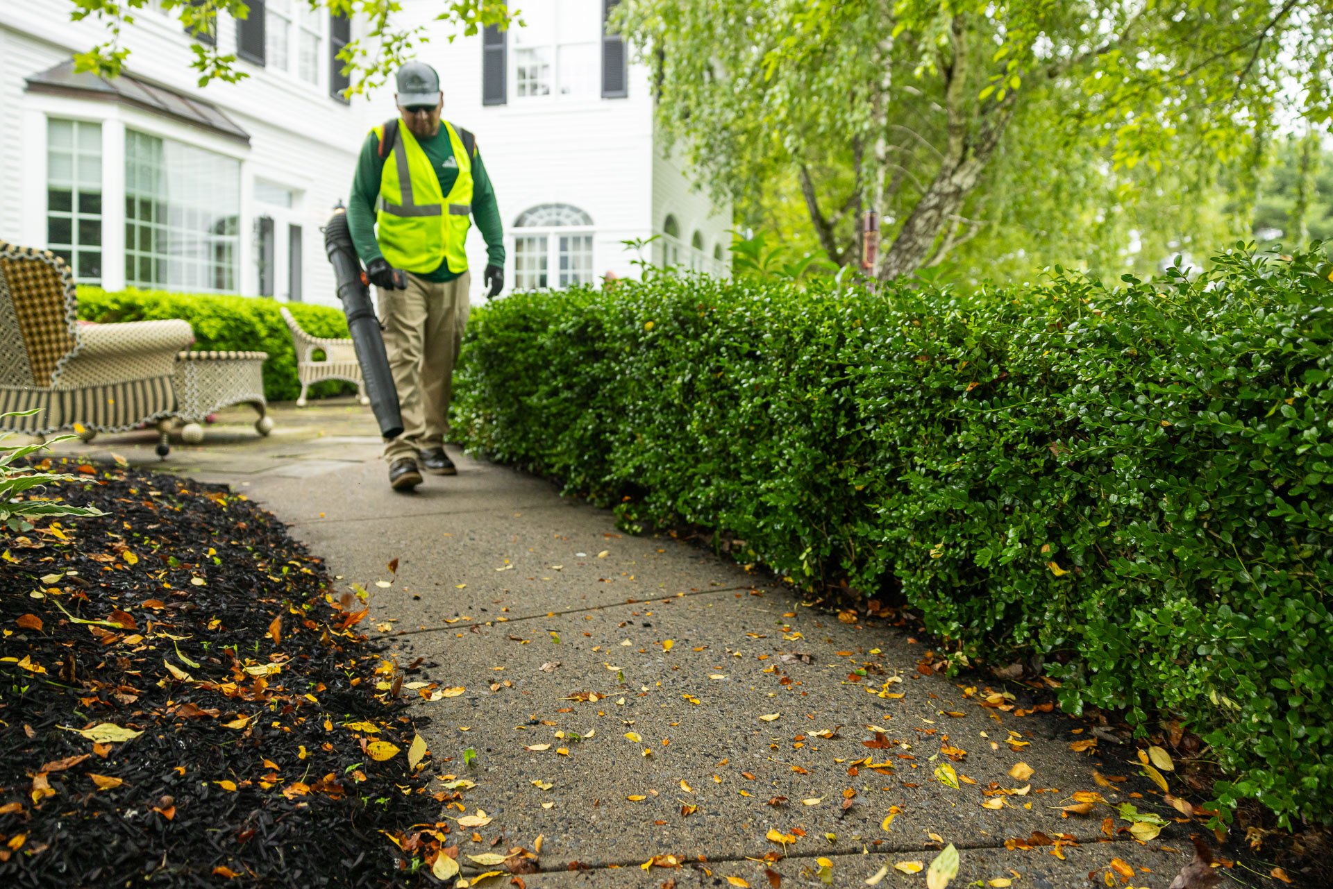 concrete sidewalk being cleared of debris