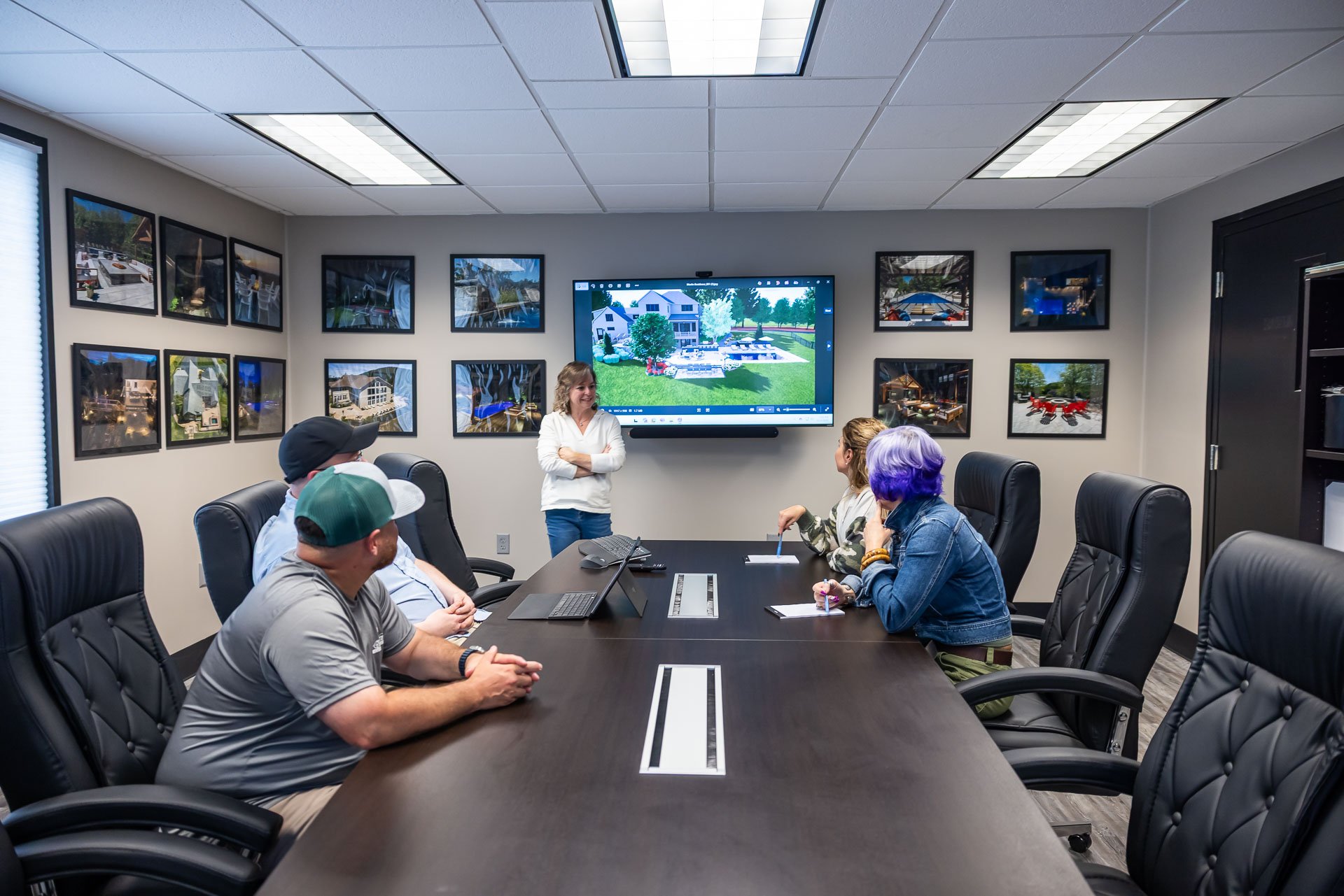 landscape design build team meeting to review a project