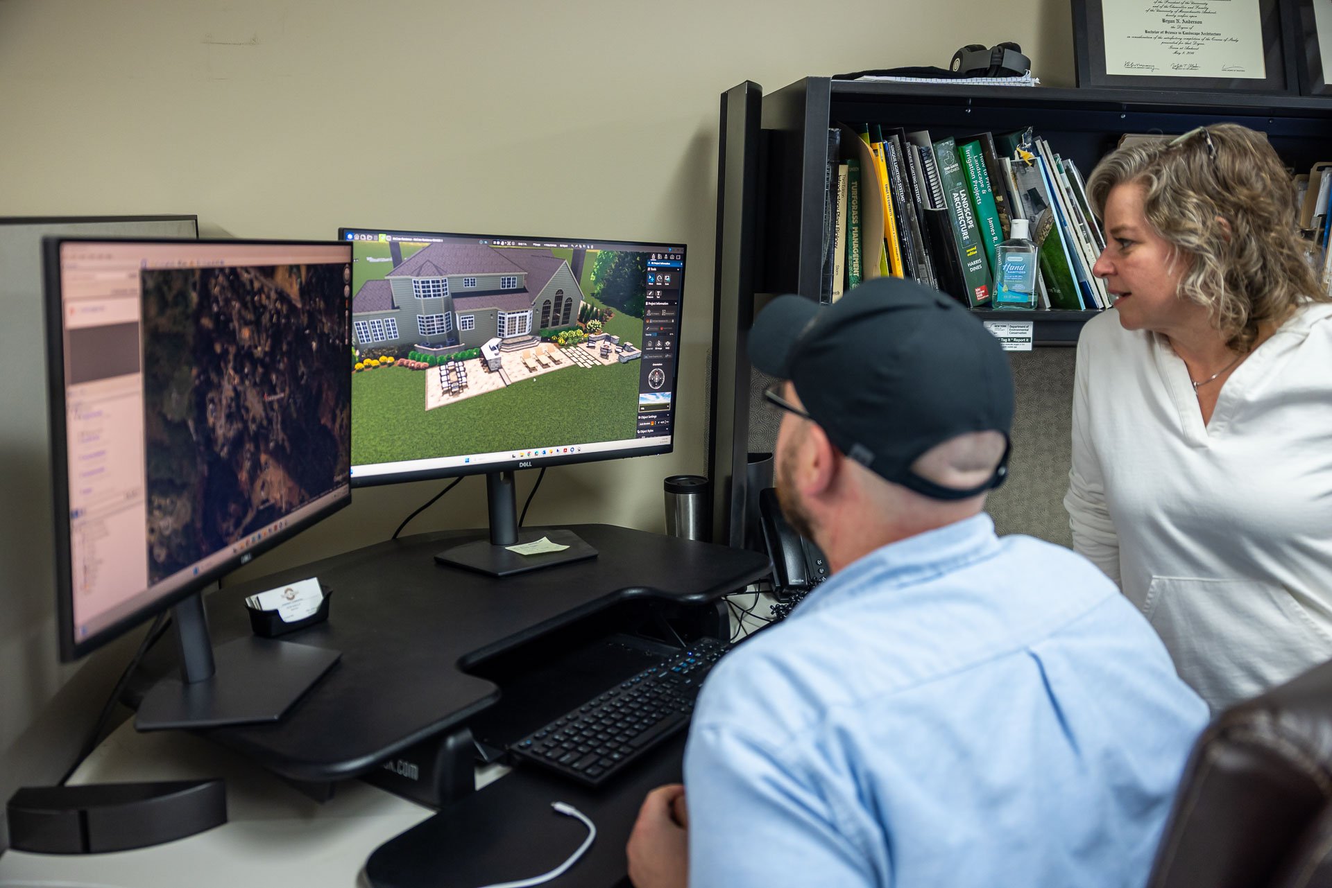 design team reviewing 3d landscape renderings