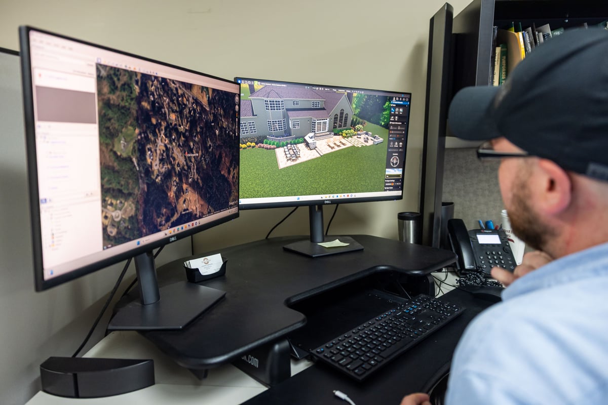 designer using aerial imagery to inform a 3d model of a landscape