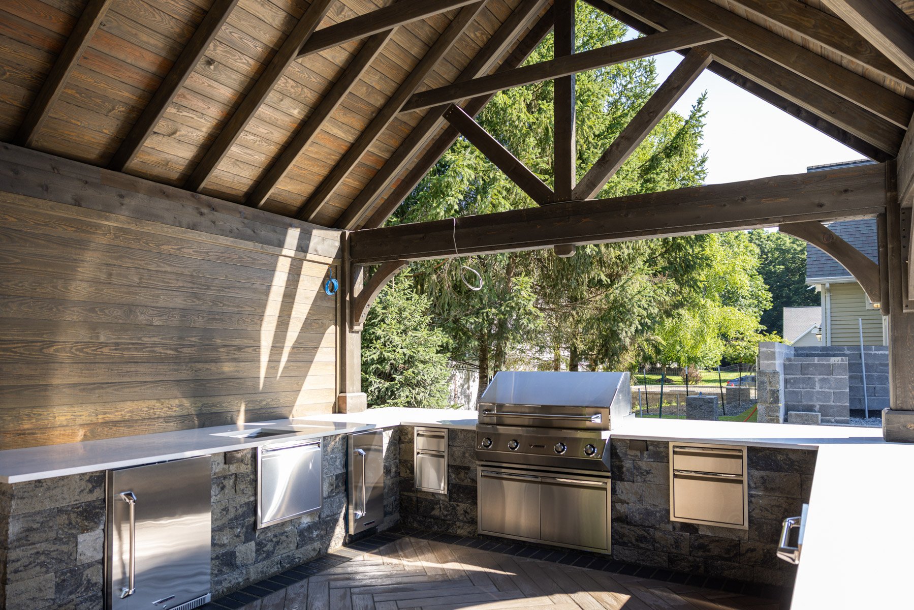 outdoor kitchens provide a gathering place while serving a function