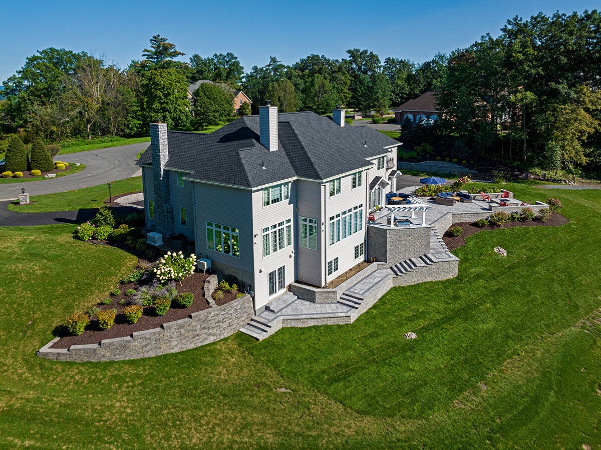 retaining walls can be built curved to match the slope of the landscape