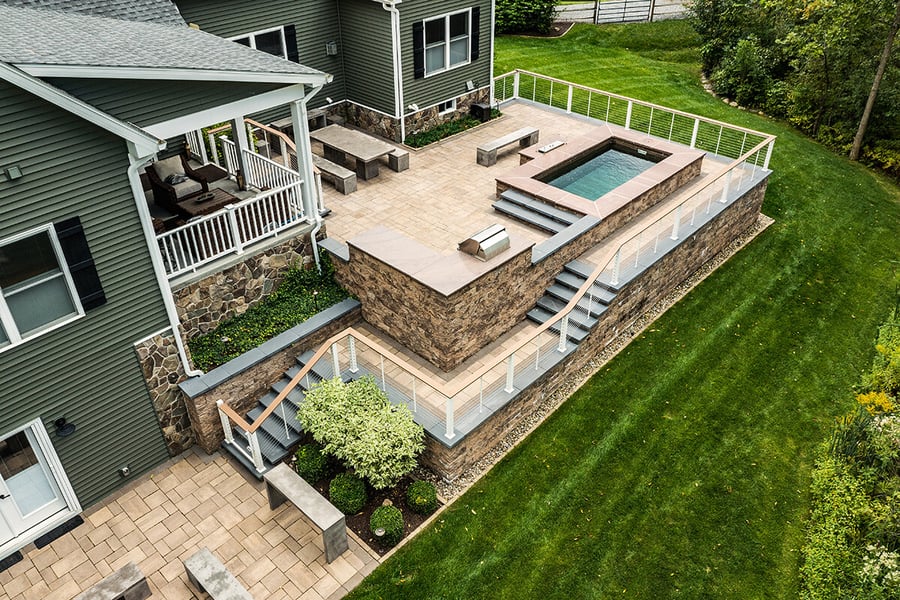 aerial pool patio stone pavers seating steps grill 2 curtis