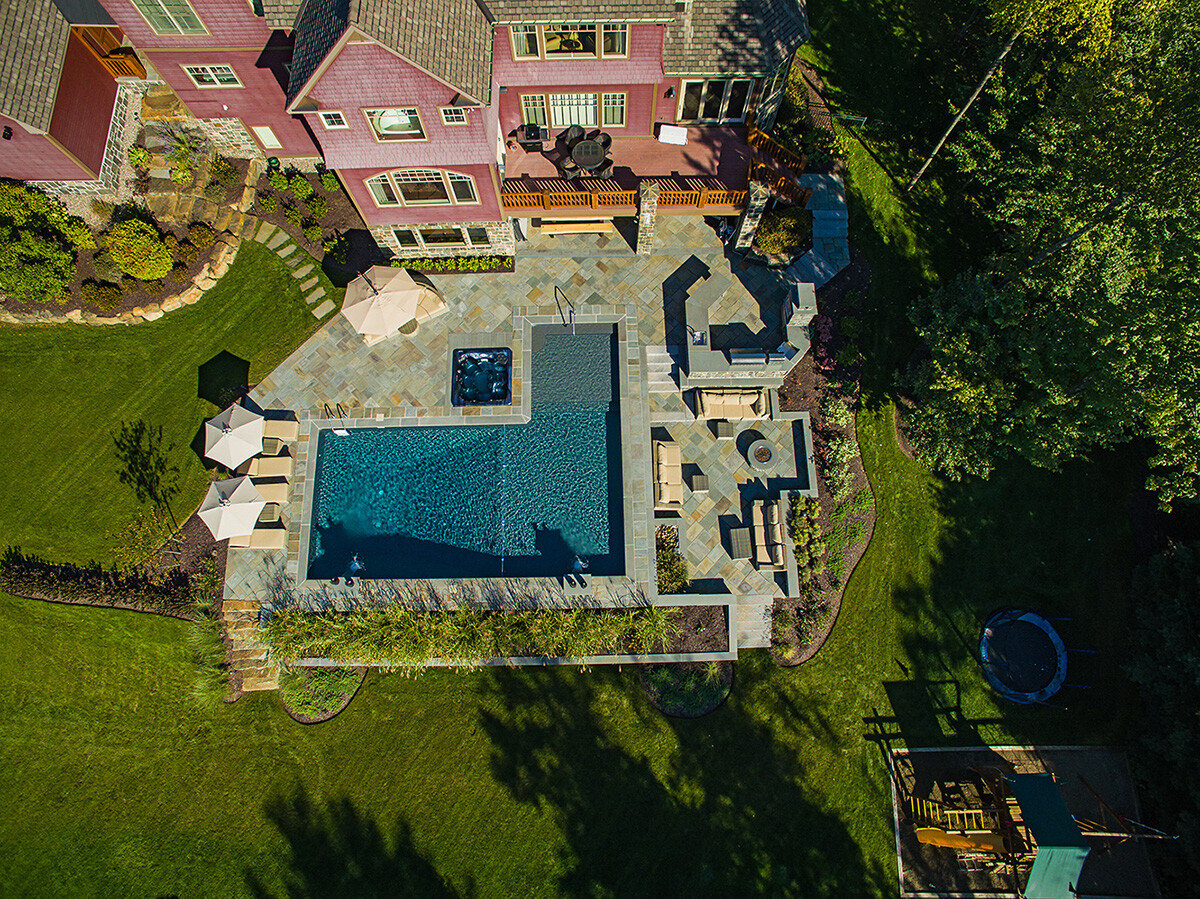 overhead view of a built-in hot tub next to a pool