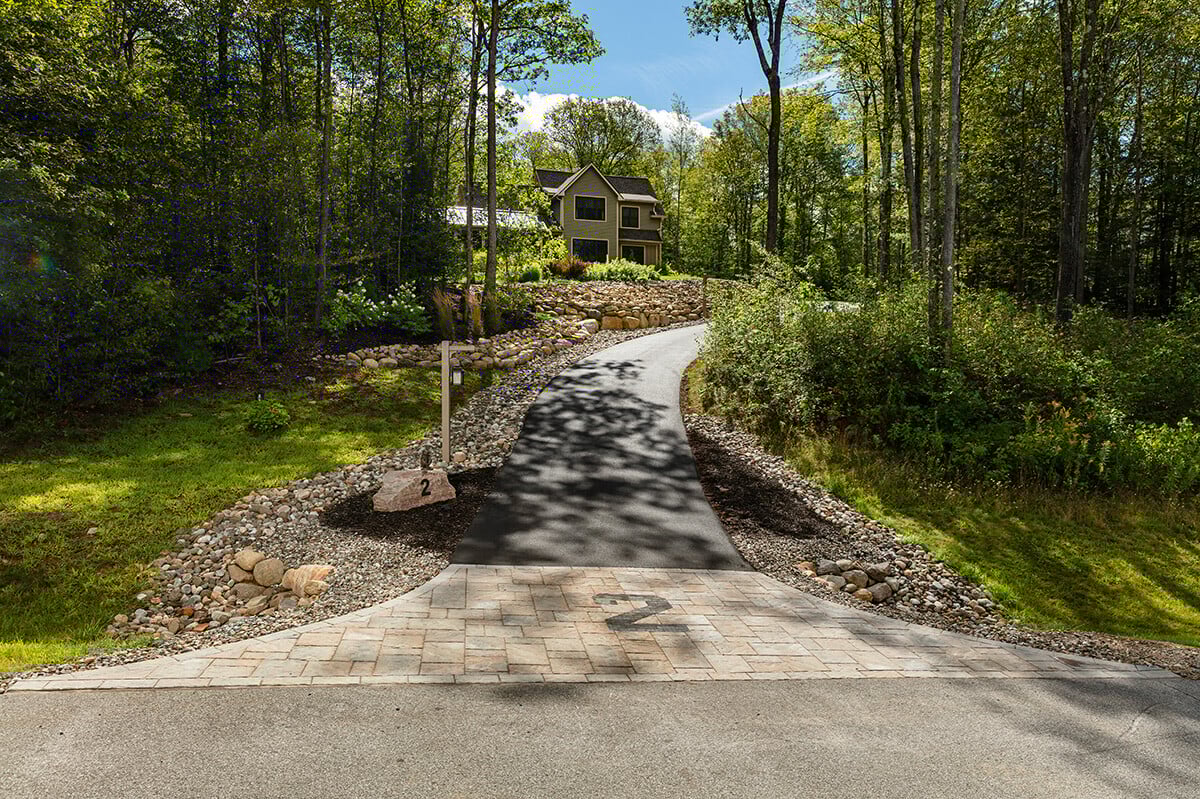 sloped driveway with gravel along the sides