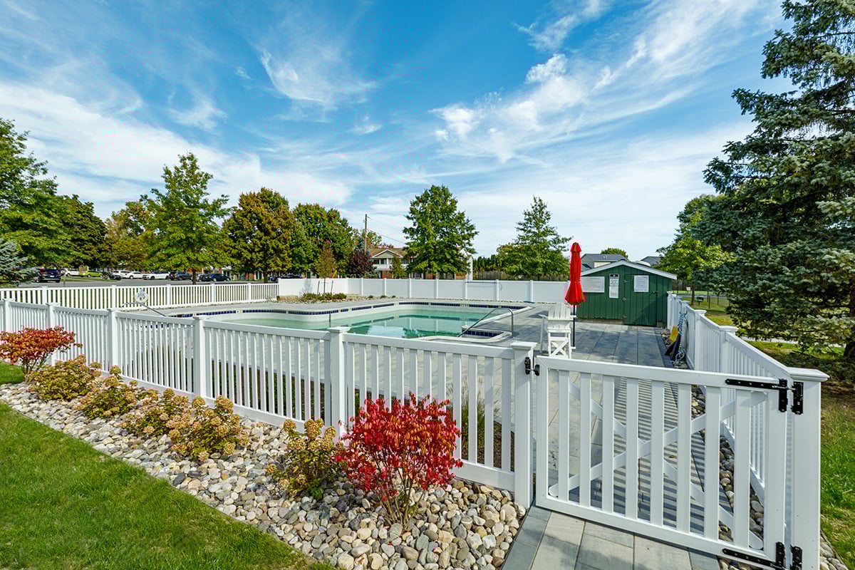 fence pool planting bed gravel commercial valley view
