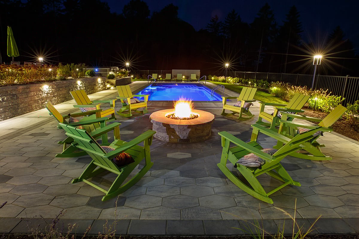 fire pit and seating by a pool