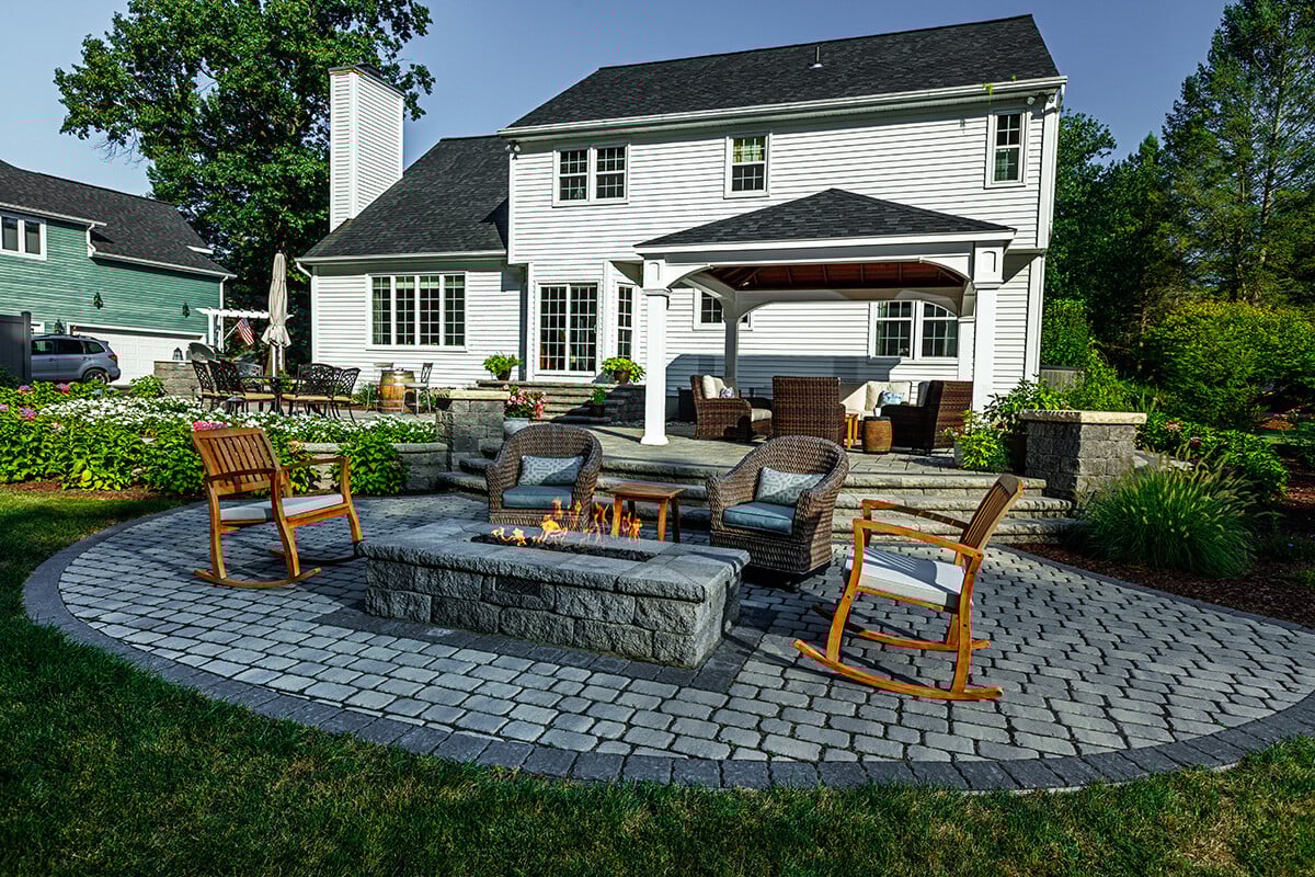 cozy backyard seating area with a gas fire pit