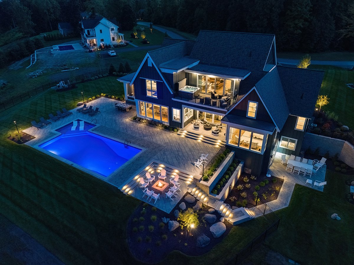 large backyard with an integrated landscape lighting plan