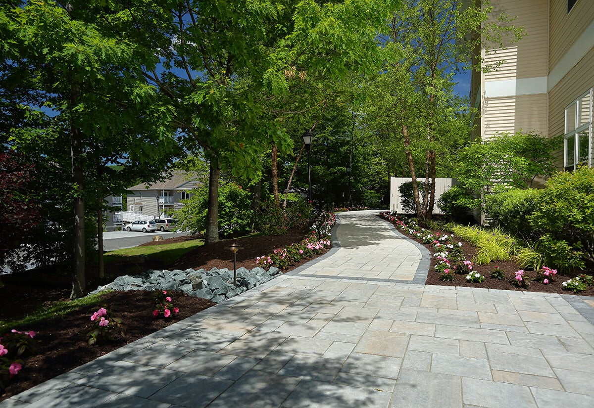 pathway stone paver flowers trees commercial Vacation Village 4