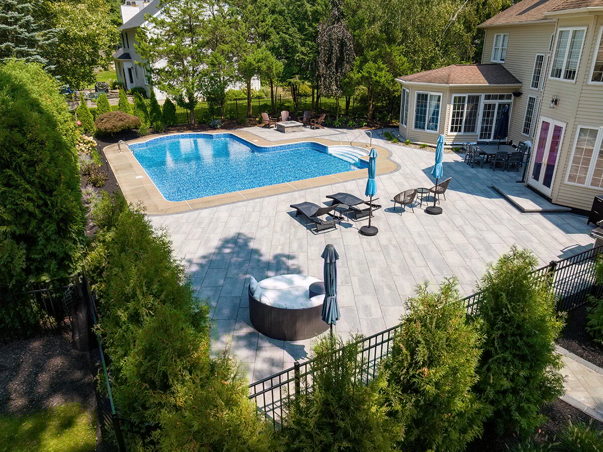 pool surrounded by arborvitae