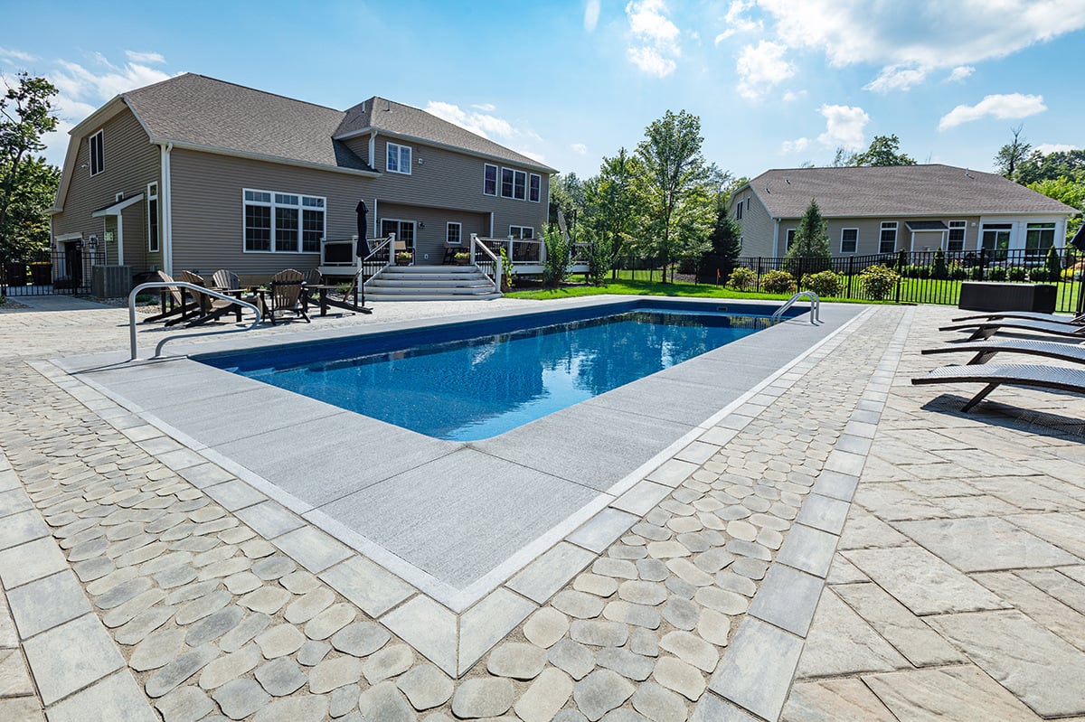 engineered pavers of different size, style, and color create this pool deck