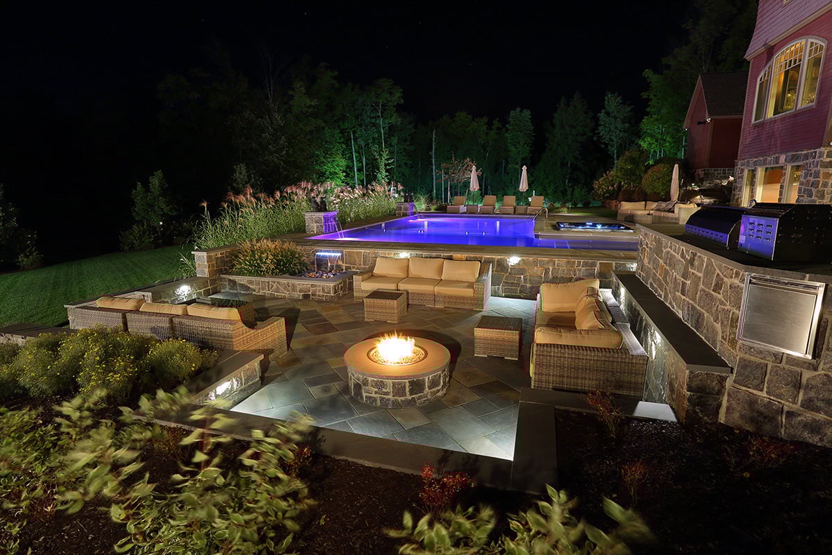 a fire pit integrated into a larger outdoor living space