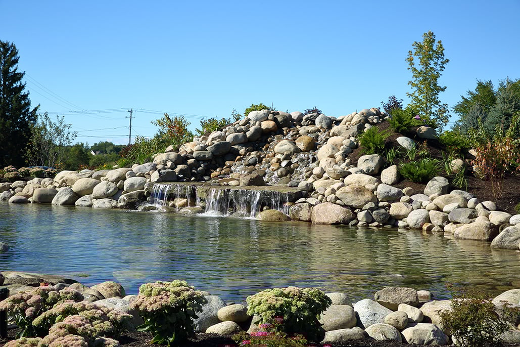 waterfall blending into a pond feature