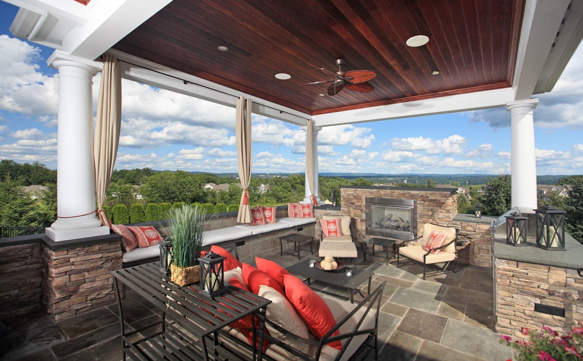 clifton park covered patio with fireplace and seating