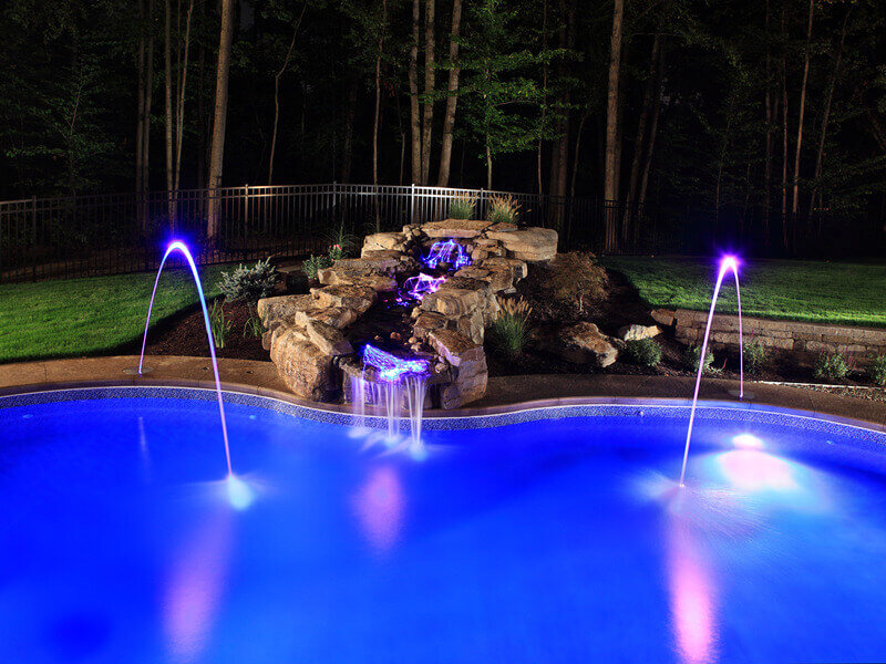 fountains on the side of a pool