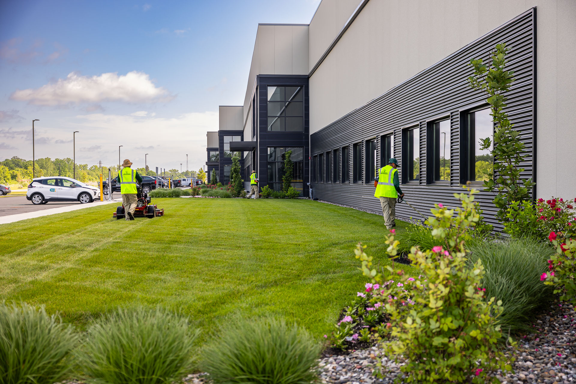 commercial crew mowing grass line trimming edging edger 3