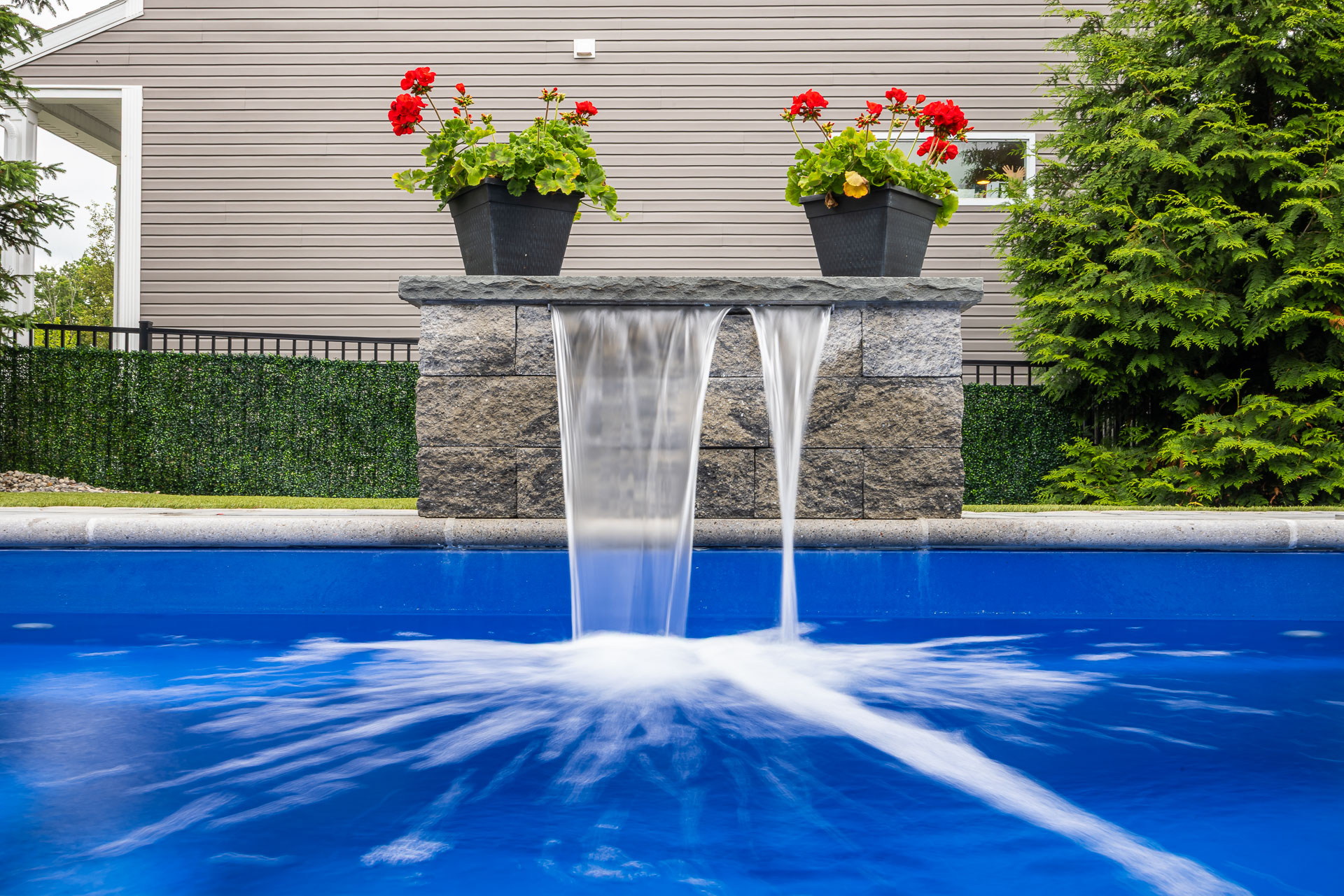 detail long exposure fountain scupper waterfall pool feature flowers