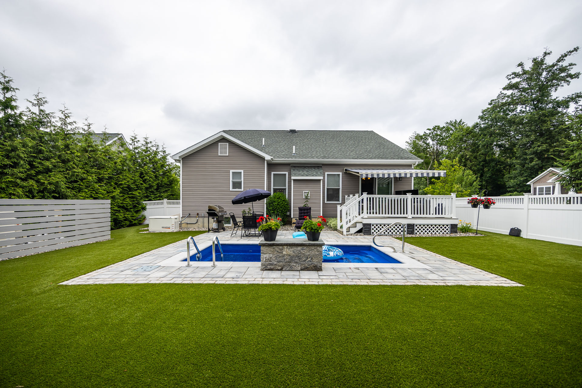 grass lawn paver patio small pool backyard 2
