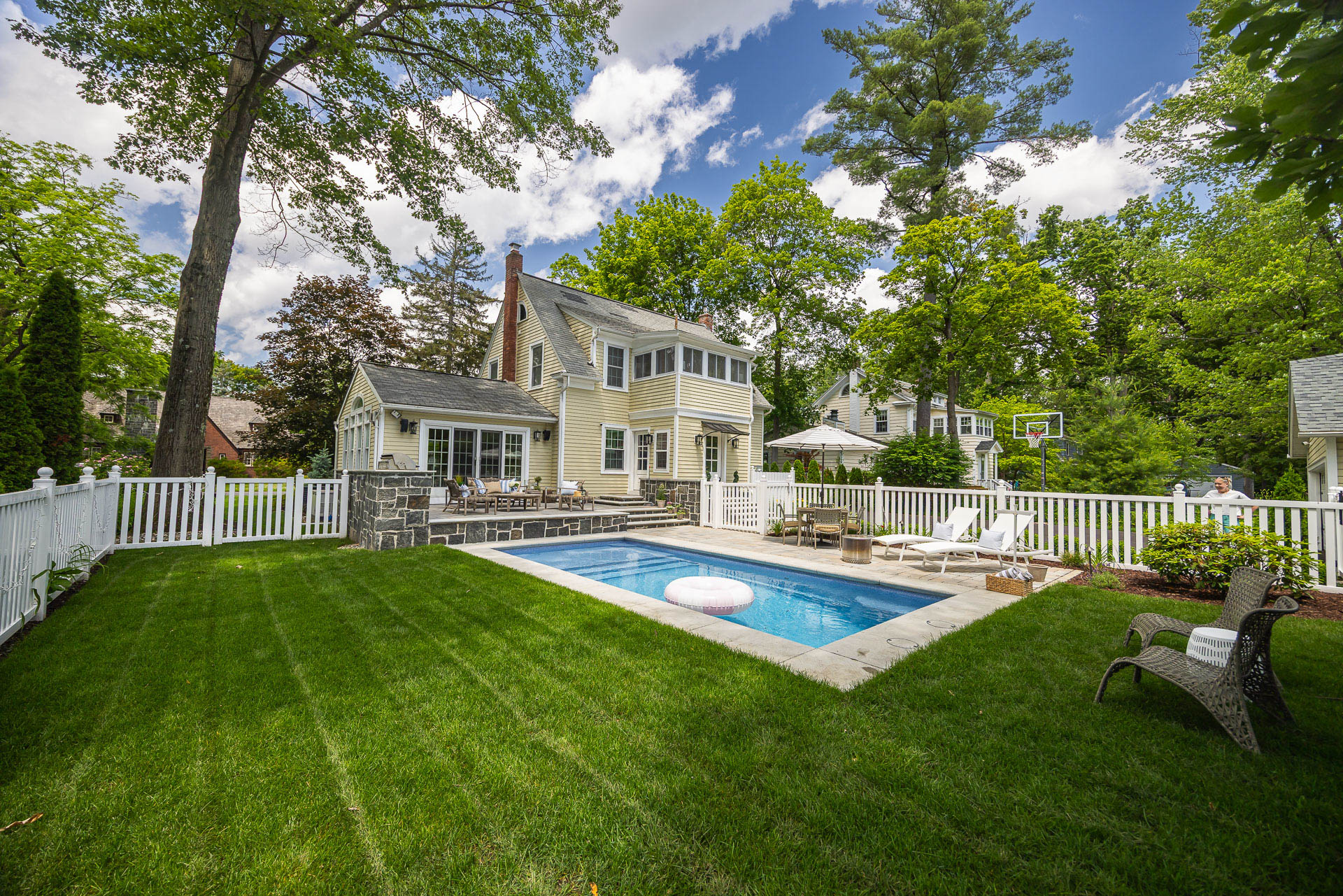 nice grass seating pool deck patio home outdoor kitchen stonework 2