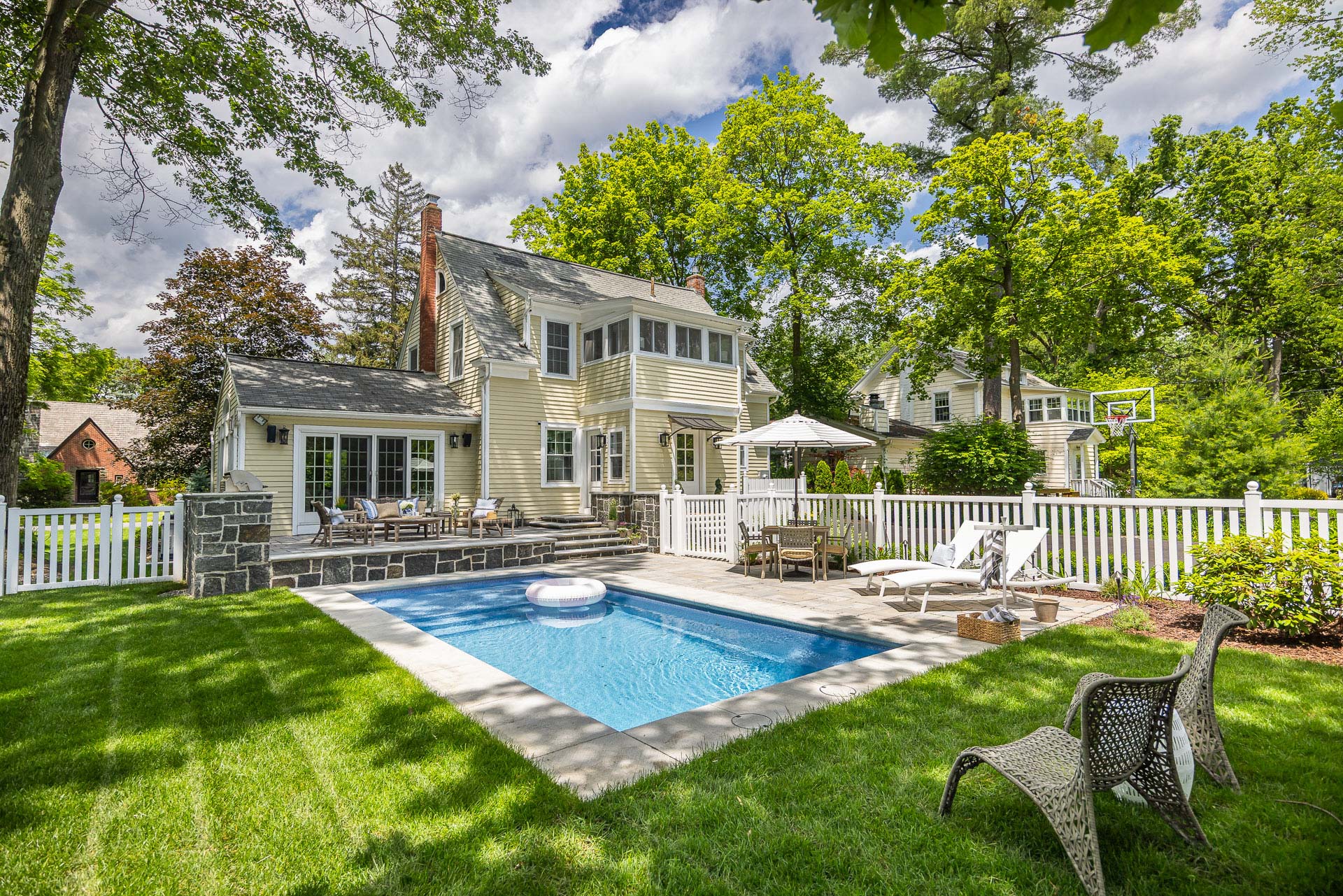 nice grass seating pool deck patio home outdoor kitchen stonework 3