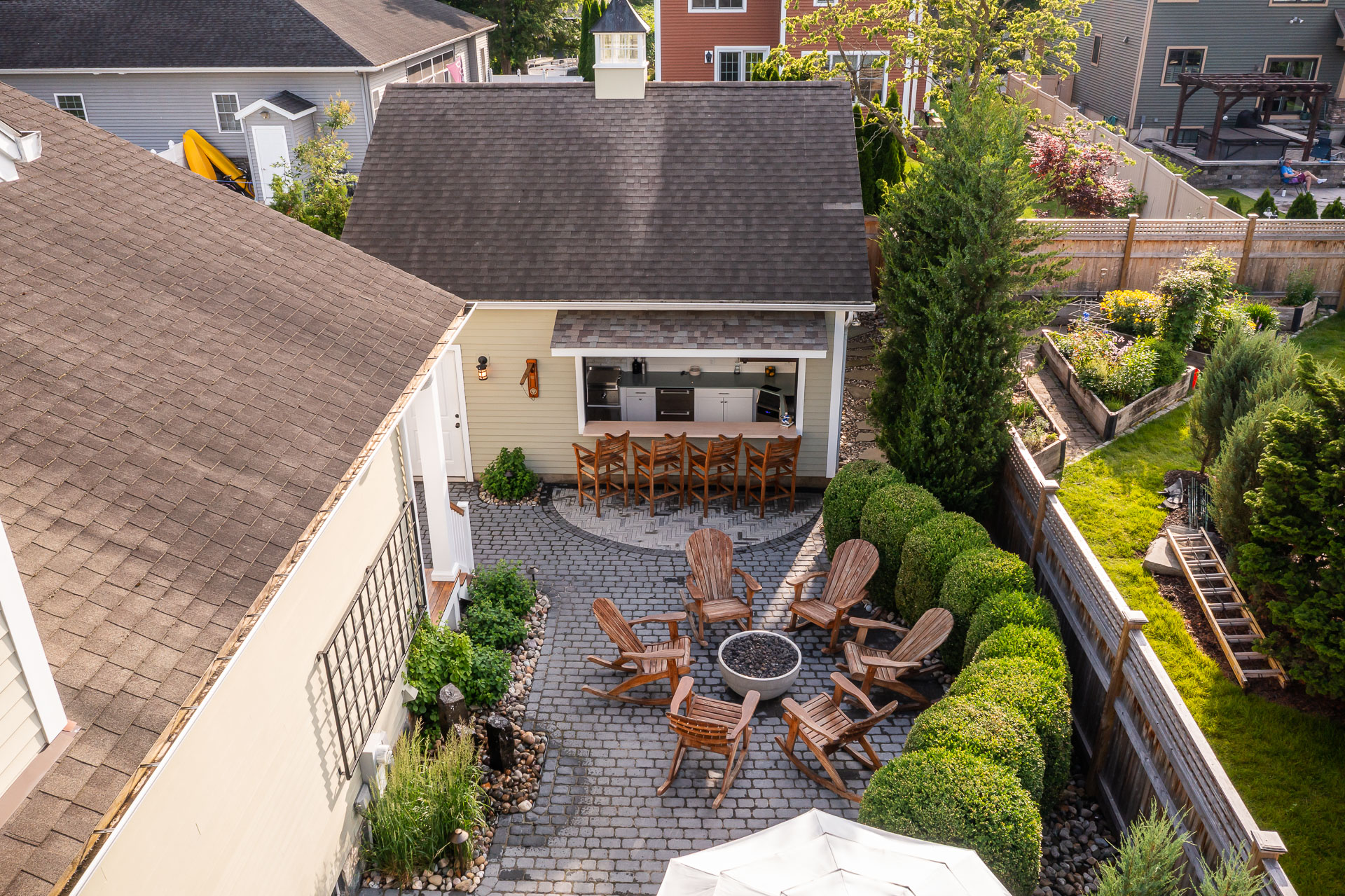 paver patio firepit seating chairs pool house bar top counter water feature basalt columns