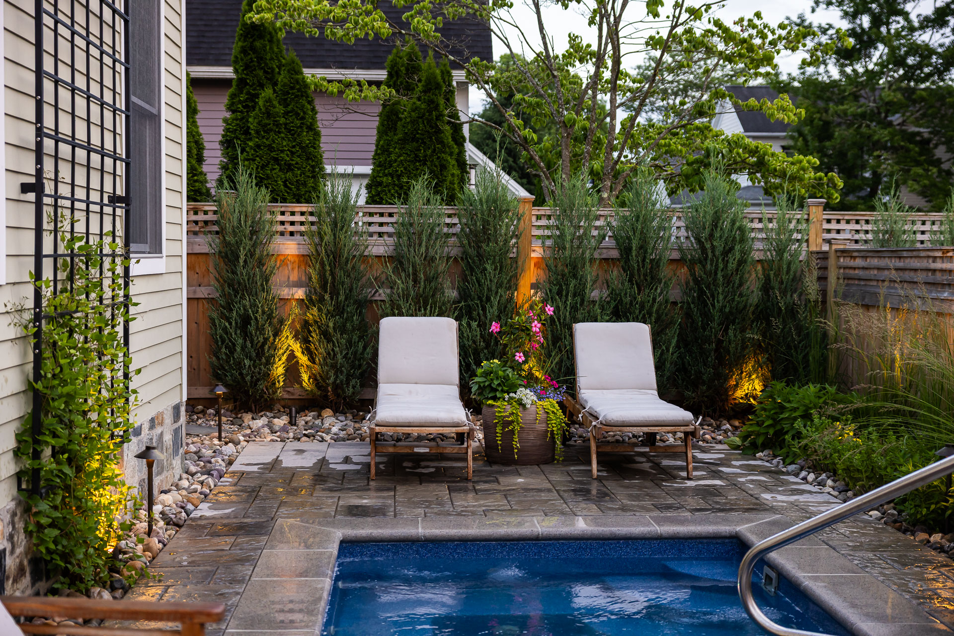 pool chairs pot trellis landscape lighting path up