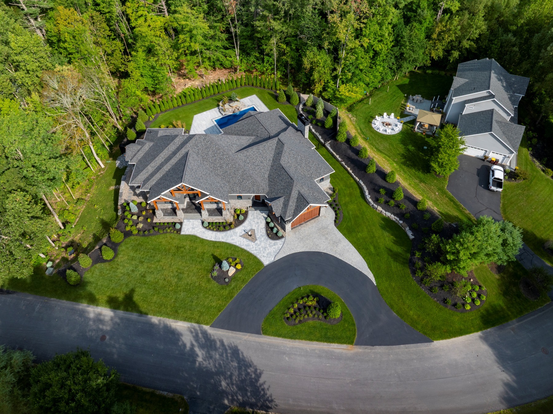 aerial driveway paver walk grass planting beds pool